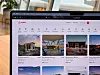 En bärbar dator visar Airbnb:s startsida med flera uthyrningsannonser i rutnät.